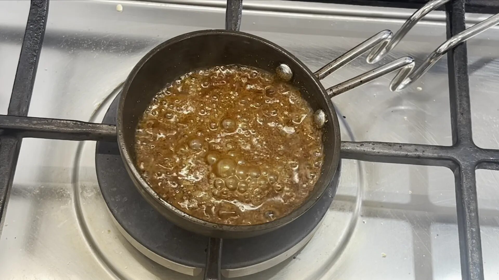 Mixing the tempered spices into the dal