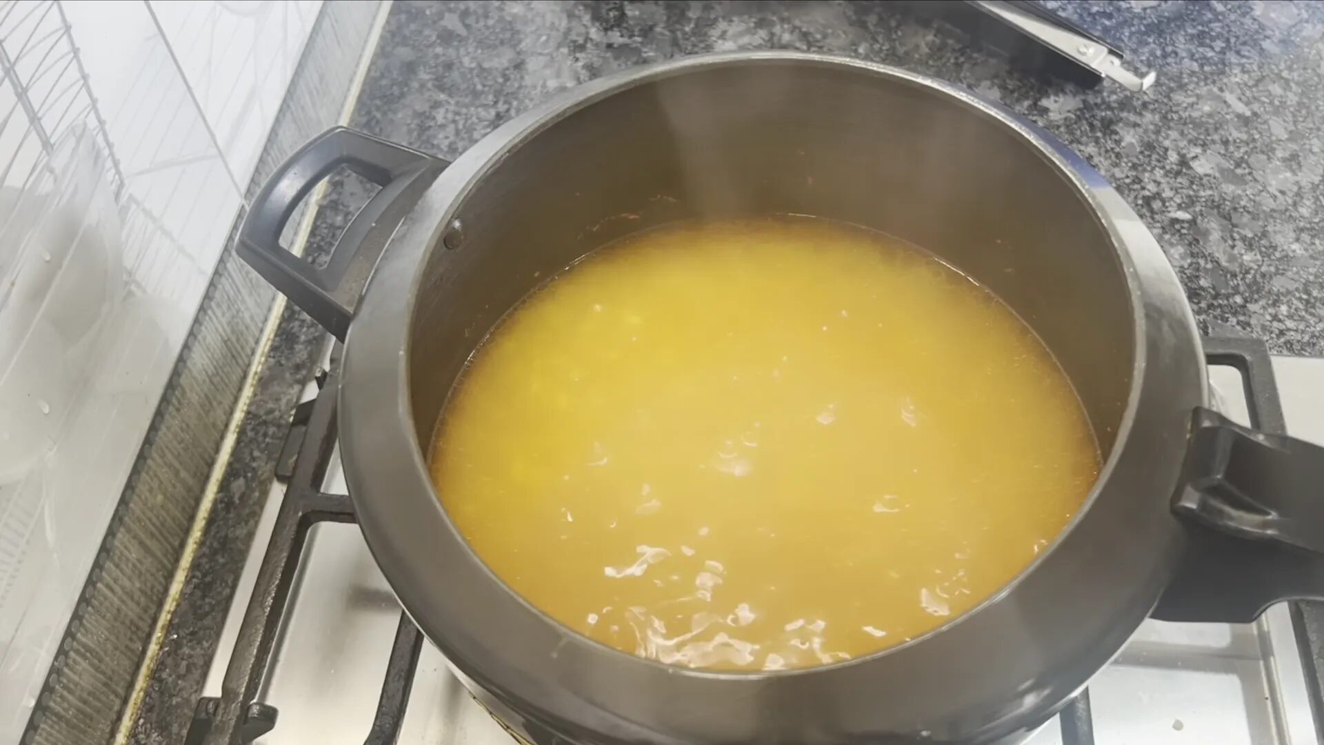 Checking the consistency of the cooked dal