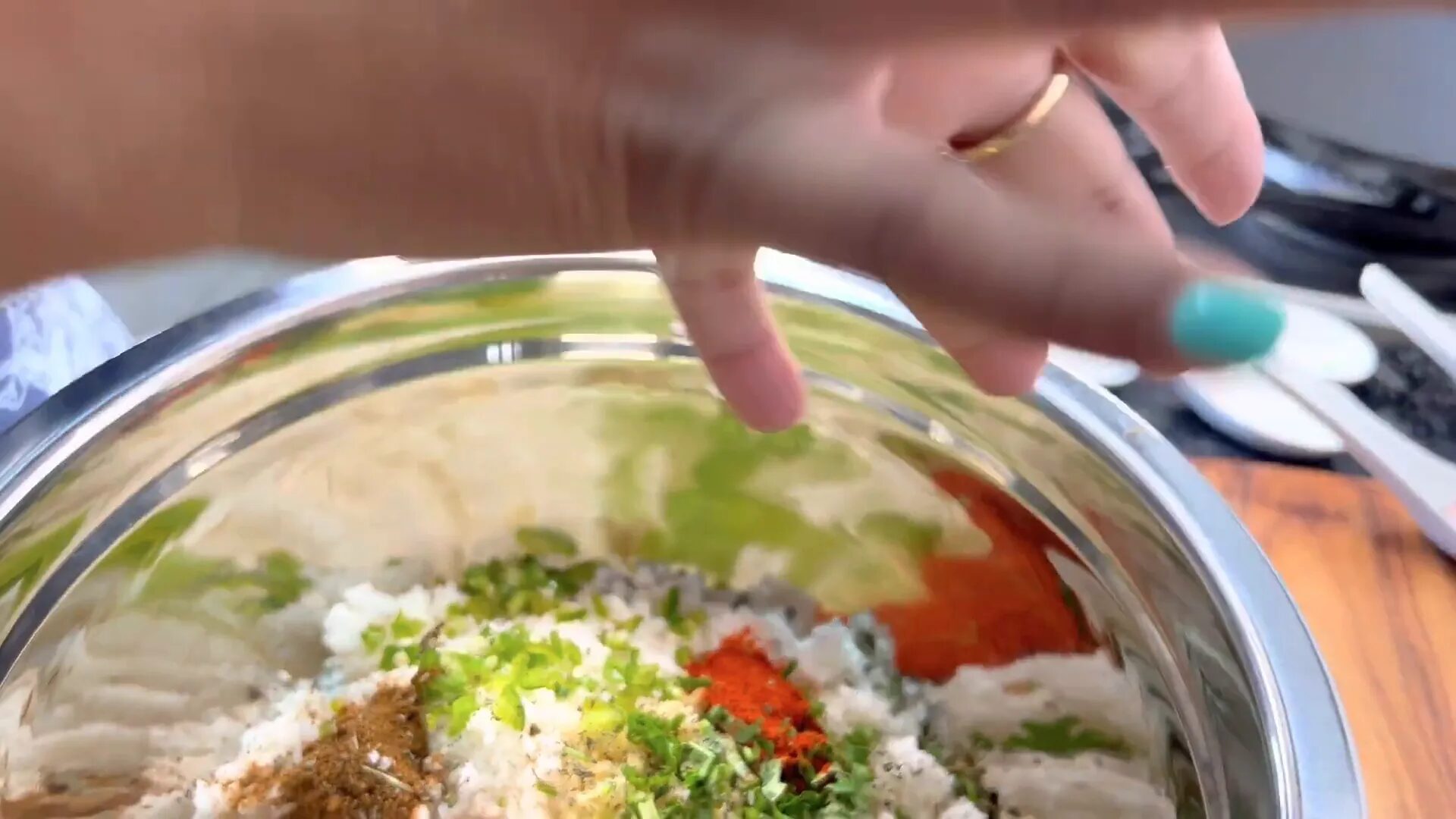 Mixing spices with grated cauliflower